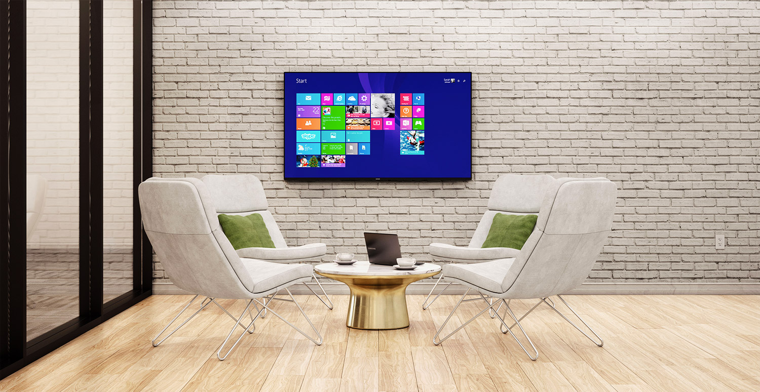 A cafe space with two chairs and a wall monitor