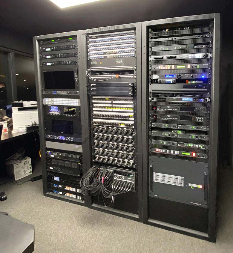 The auditorium’s AV system components such as the Extron XTP II CrossPoint matrix switcher, the multi-window processor, and the dual-recording streaming media processor are conveniently rack-mounted within the control center.