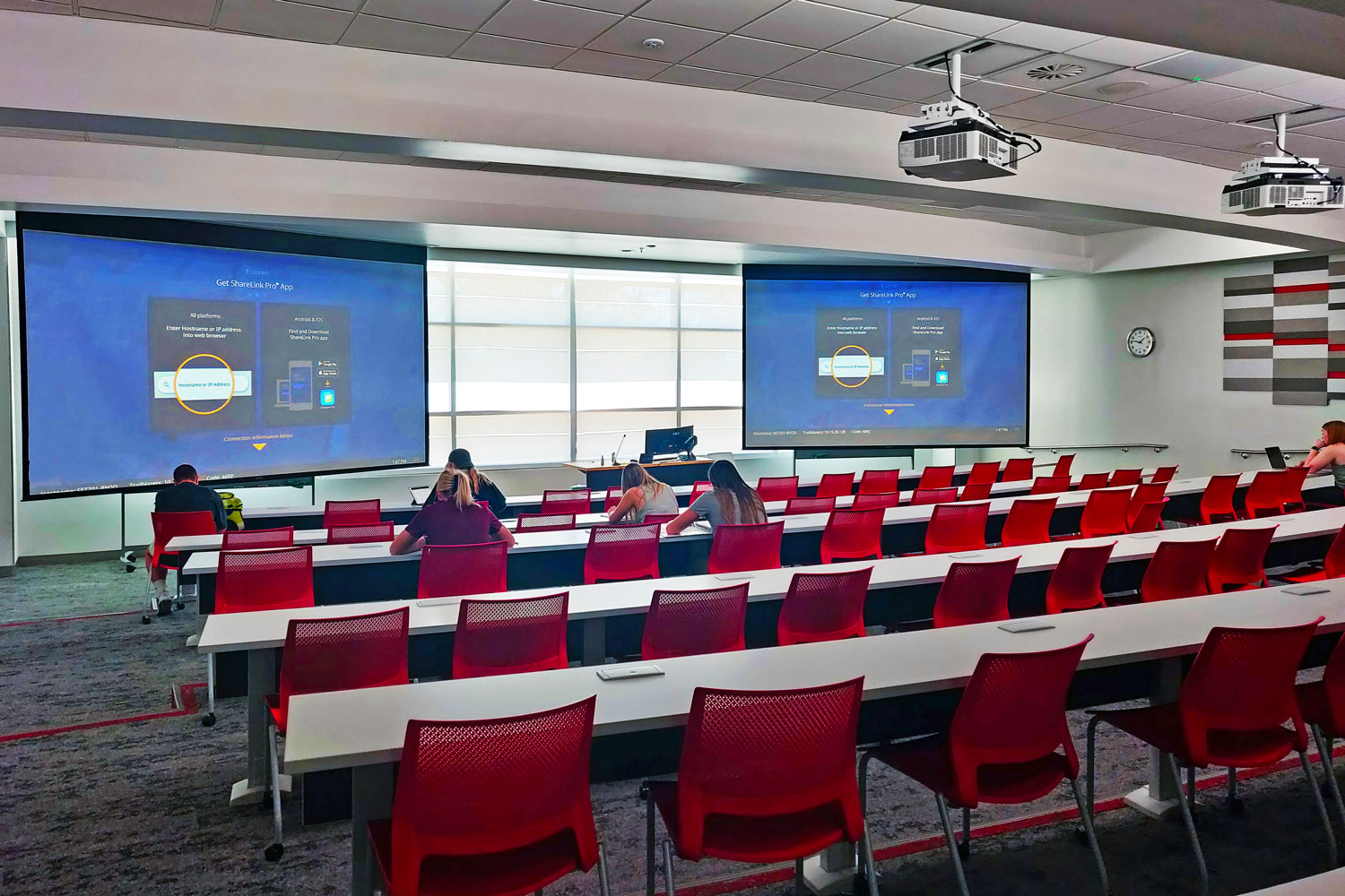 Large classrooms have multiple displays and multiple directional mic arrays.