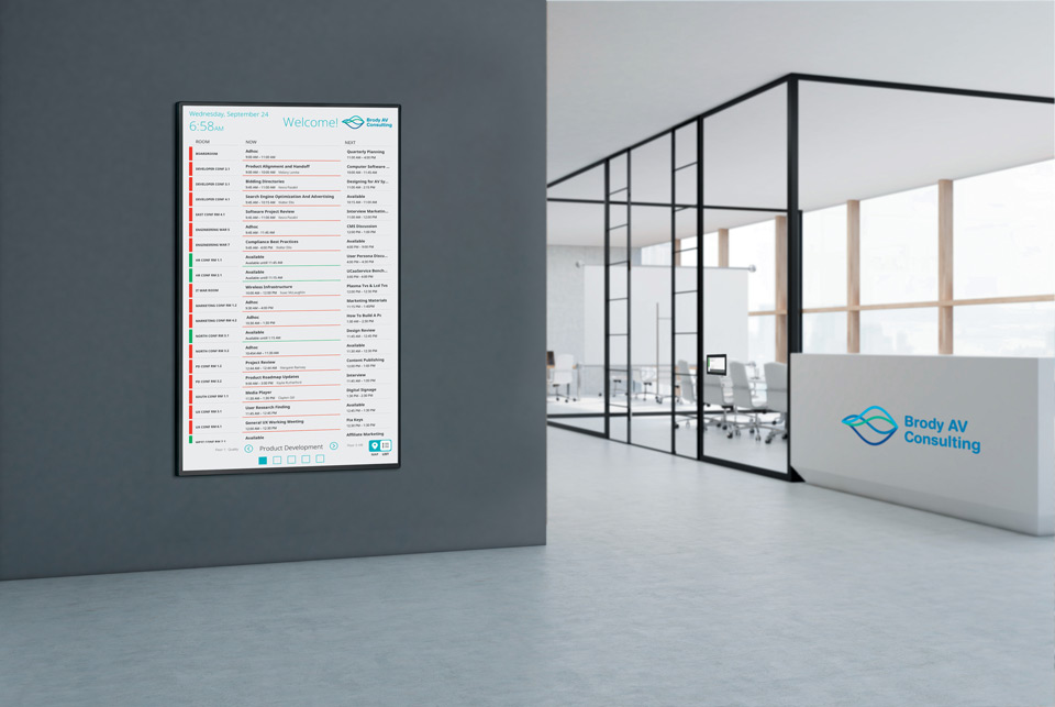 Extron Room Scheduling panel in an interactive list view placed on an office wall (portrait layout).